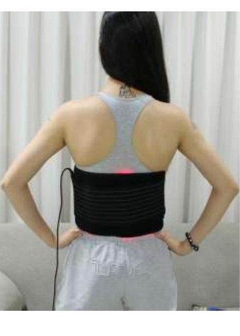 Red light therapy belt fastened around the back